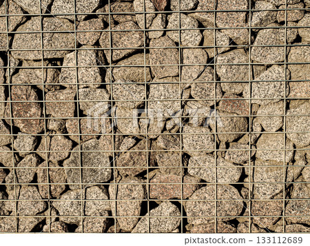 Gabions are a lattice texture with stones Gabions are a lattice texture with stones 133112689