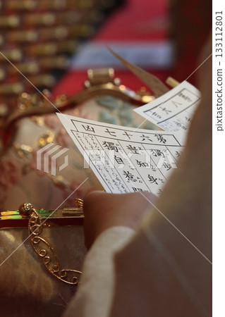 Tourists drawing fortune slips at Sensoji Temple Tourists drawing fortune slips at Sensoji Temple 133112801
