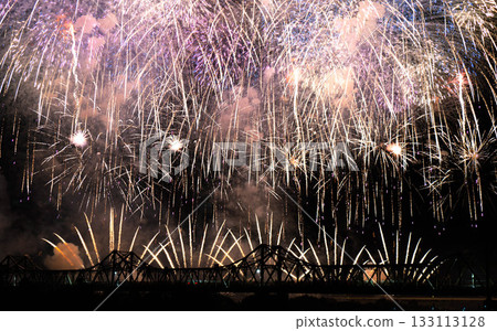 Fireworks dancing in the night sky at Nagaoka Chosei Bridge Fireworks dancing in the night sky at Nagaoka Chosei Bridge 133113128