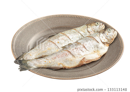Isolated portion of two raw whole fish on plate Isolated portion of two raw whole fish on plate 133113148