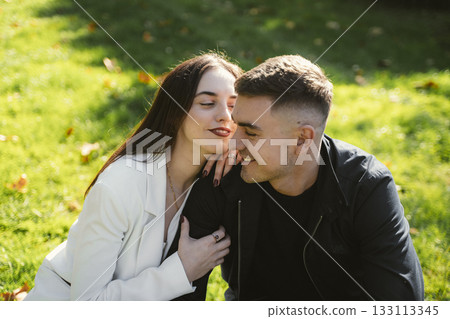 Romantic Moment of Laughing Couple in a Park Romantic Moment of Laughing Couple in a Park 133113345