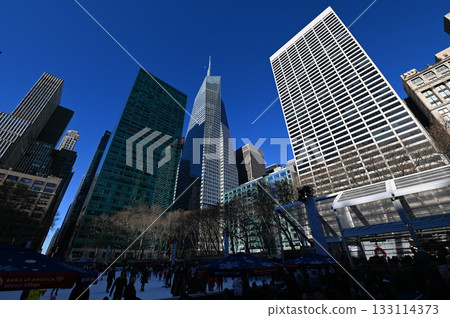 Skyscrapers rising in the blue sky Skyscrapers rising in the blue sky 133114373