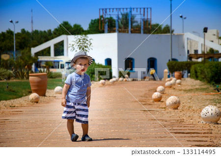 Portrait of young boy at the resort. Boy near the hotel in Egypt. 133114495