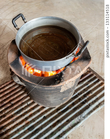 Boiling Water Pot on Traditional Charcoal Stove. 133114518