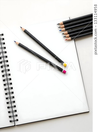 Open Spiral Notebook with Black Pencils on White Desk Open Spiral Notebook with Black Pencils on White Desk 133114958