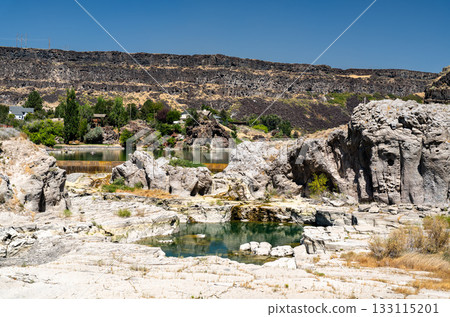 View of the Shoshone Falls riverbed in Twin Falls, Idaho, during a period of low water. Exposed rocks and small pools of water are visible in the canyon View of the Shoshone Falls riverbed in Twin Falls, Idaho, during a period of low water. Exposed rocks and small pools of water are visible in the canyon 133115201