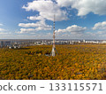 Aerial tv tower in autumn forest with scenic sky 133115571