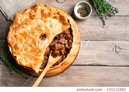 Beef steak pie with crispy puff pastry Beef steak pie with crispy puff pastry 133115802