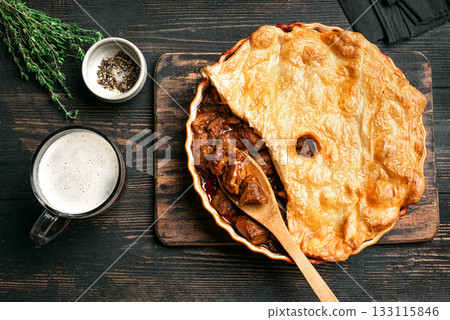 Beef steak pie with dark beer gravy and crispy puff pastry 133115846