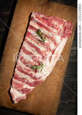 Raw pork ribs on wooden table 133115903