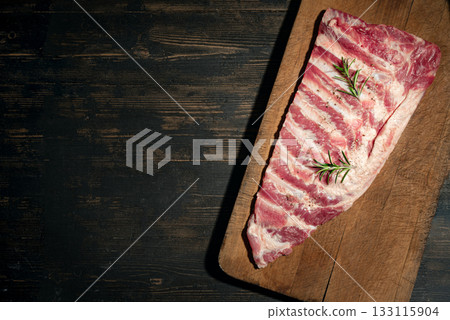 Raw pork ribs on wooden table 133115904