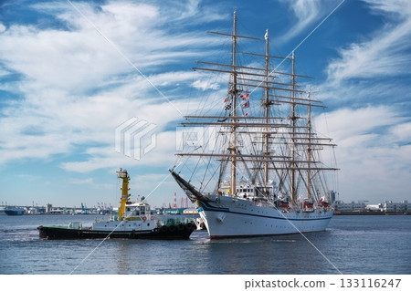 Nippon Maru being pushed by a tugboat to dock at Garden Pier. 133116247