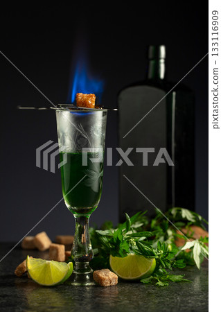 Burning sugar on a glass with absinthe. 133116909