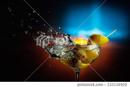 Martini with green olives and lemon. Martini with green olives and lemon. 133116920