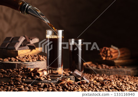 Coffee liquor is poured into a glass. 133116940
