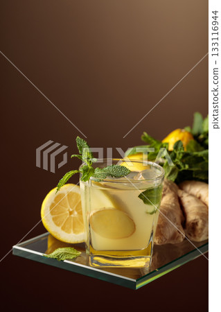 Refreshing summer cocktail with natural ice, ginger, lemon, and mint. Refreshing summer cocktail with natural ice, ginger, lemon, and mint. 133116944