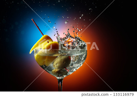 Martini with green olives and lemon. 133116979