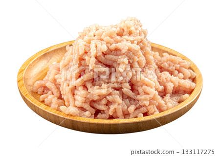 Isolated raw ground chicken on wooden plate Isolated raw ground chicken on wooden plate 133117275