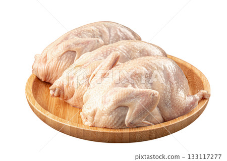 Isolated raw whole chickens on plate 133117277