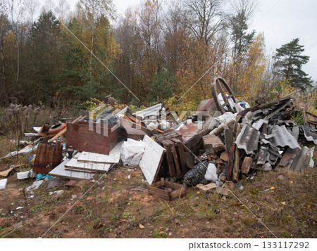 forest waste threat, unauthorized refuse accumulation threatens natural habitats at forest boundary, illegal dumping of construction waste and tires jeopardizes local wildlife forest waste threat, unauthorized refuse accumulation threatens natural habitats at forest boundary, illegal dumping of construction waste and tires jeopardizes local wildlife 133117292