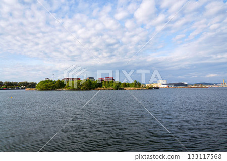 Sustainable cabins with natural materials on waterfront in Kvillepiren, Hisingen, sunny day, Gothenburg, Sweden Sustainable cabins with natural materials on waterfront in Kvillepiren, Hisingen, sunny day, Gothenburg, Sweden 133117568