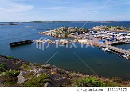 Ships harbour at Saltholmen peninsula on the shore of Alvsborgsfjorden, harbour for archipelago ships, Alvsborg district,  sunny day, Gothenburg, Sweden 133117575