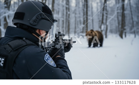 A police officer from the Bear Control Response Project Team holds his rifle and waits for the right moment to fire. A police officer from the Bear Control Response Project Team holds his rifle and waits for the right moment to fire. 133117628