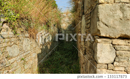 Historic Sirsukh wall in Taxila built with aligned stones showing ancient urban defense style Historic Sirsukh wall in Taxila built with aligned stones showing ancient urban defense style 133117873