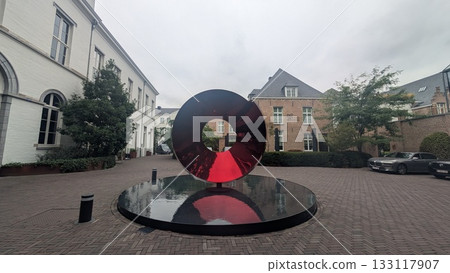 A metallic red object on the water in Antwerp 133117907