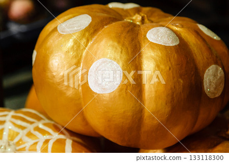 beautiful painted pumpkins of white and gold color on halloween 133118300