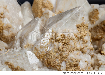 Macro mineral stone Snow quartz with calcite on a black background Macro mineral stone Snow quartz with calcite on a black background 133118317