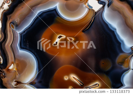 Macro mineral stone Yellow, brown Agate breed a white background 133118373