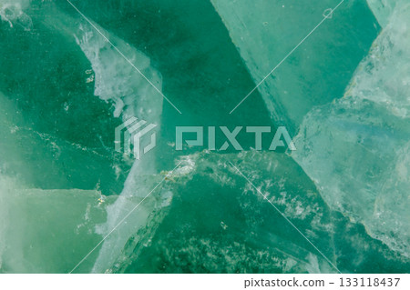 Macro mineral stone Fluorite crystal on a black background 133118437