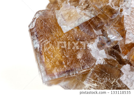 Macro mineral stone yellow Fluorite on a white background Macro mineral stone yellow Fluorite on a white background 133118535