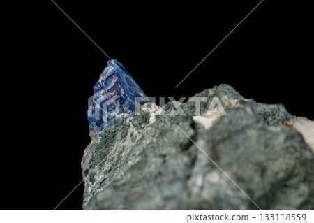 Macro mineral stone Bentorite on a black background 133118559