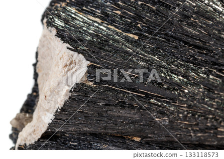 Macro mineral stone Schorl, Black Tourmaline on a white background 133118573