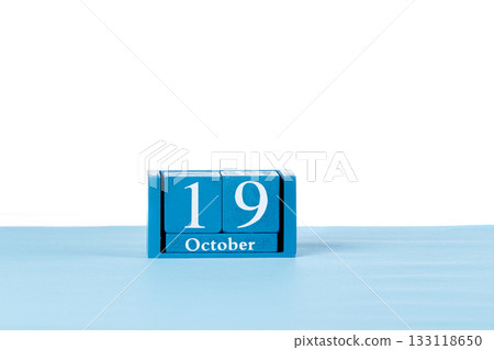 Wooden calendar October 19 on a white background 133118650