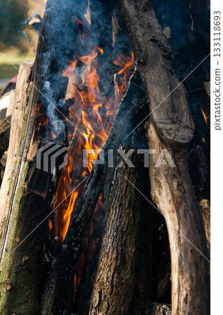 Beautiful fire flames on a campfire Beautiful fire flames on a campfire 133118693