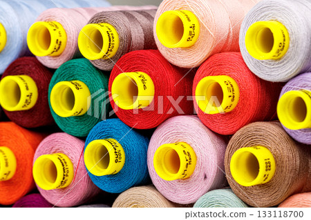 set of multi-colored spools of thread for sewing set of multi-colored spools of thread for sewing 133118700