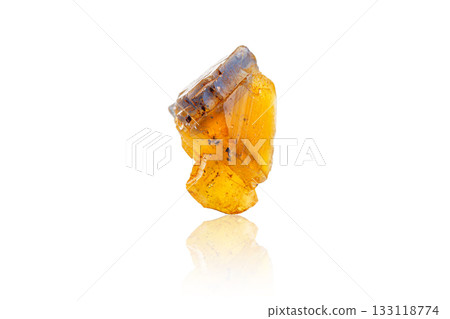 Macro mineral stone Fluorite yellow and blue color on a white background Macro mineral stone Fluorite yellow and blue color on a white background 133118774