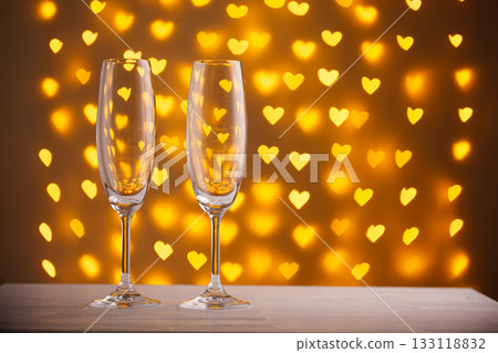 beautiful glasses of champagne on a blurred background of hearts beautiful glasses of champagne on a blurred background of hearts 133118832