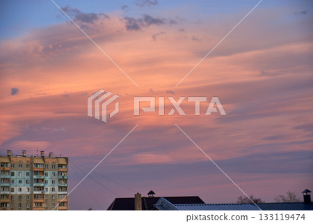 Lenticular round clouds over houses in the city at sunset 133119474