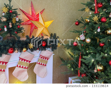 Glowing fireplace and presents beneath the tree Glowing fireplace and presents beneath the tree 133119614