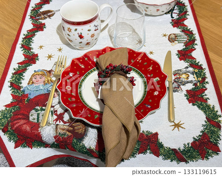 Santa themed Christmas table with plates and fork Santa themed Christmas table with plates and fork 133119615