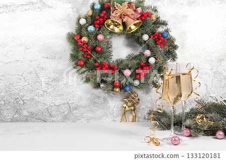 Happy New Year. Two glasses of champagne against a festive backdrop of fir branches and decorations, a Christmas Eve concept. Christmas and New Year's mockup for product design and sales Happy New Year. Two glasses of champagne against a festive backdrop of fir branches and decorations, a Christmas Eve concept. Christmas and New Year's mockup for product design and sales 133120181