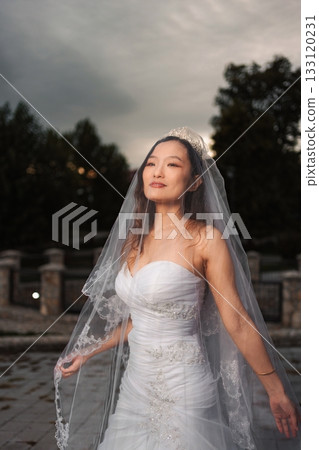 Chinese bride wearing white wedding dress on special day 133120231