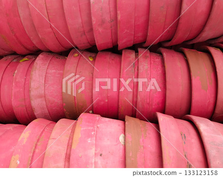 Rows of empty terracotta plant pots stacked in bulk, classic red clay planters prepared for gardening in outdoor storage area Rows of empty terracotta plant pots stacked in bulk, classic red clay planters prepared for gardening in outdoor storage area 133123158