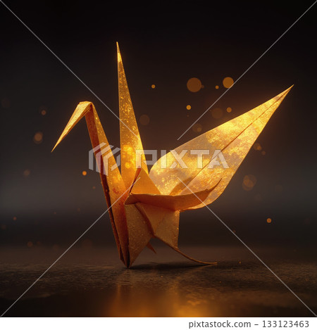 Glowing golden origami crane shines softly in a dark setting during a quiet evening moment 133123463