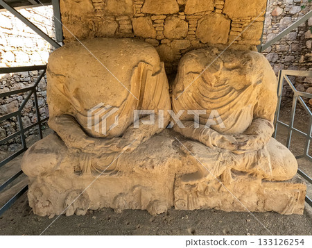Heritage Twin seated Buddha statue fragments in Gandhara monastery Mohra Muradu Taxila ruins Pakistan 133126254