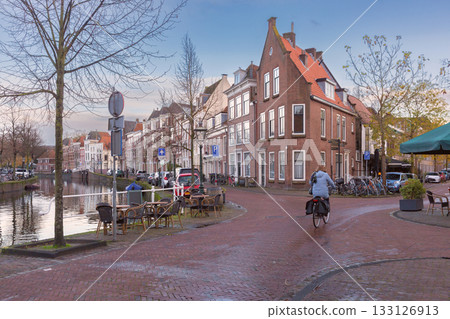 Street and canal view in Leiden Netherlands at sunrise 133126913